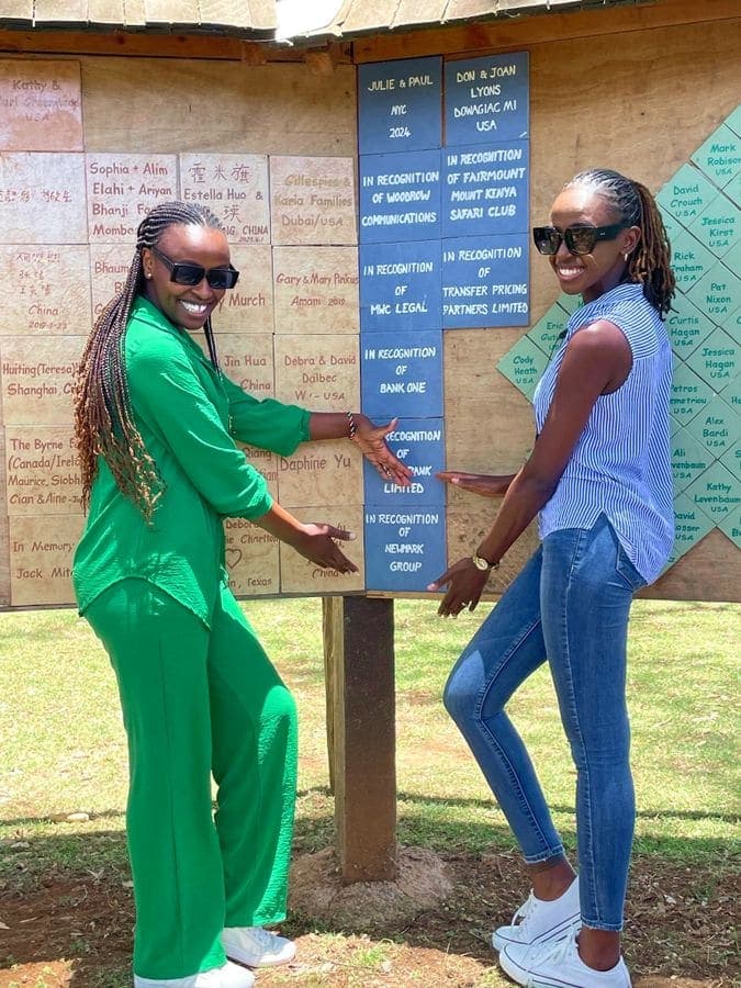 Colleagues unveiling a recognition board