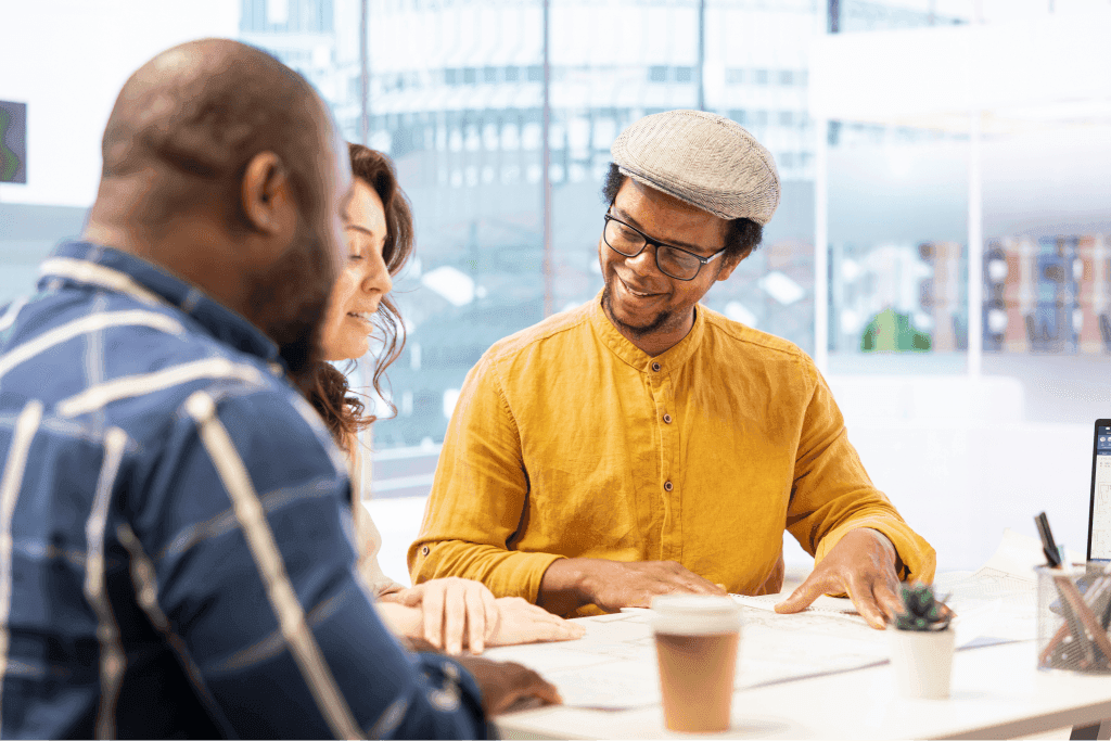 Colleagues collaborating over documents in a meeting